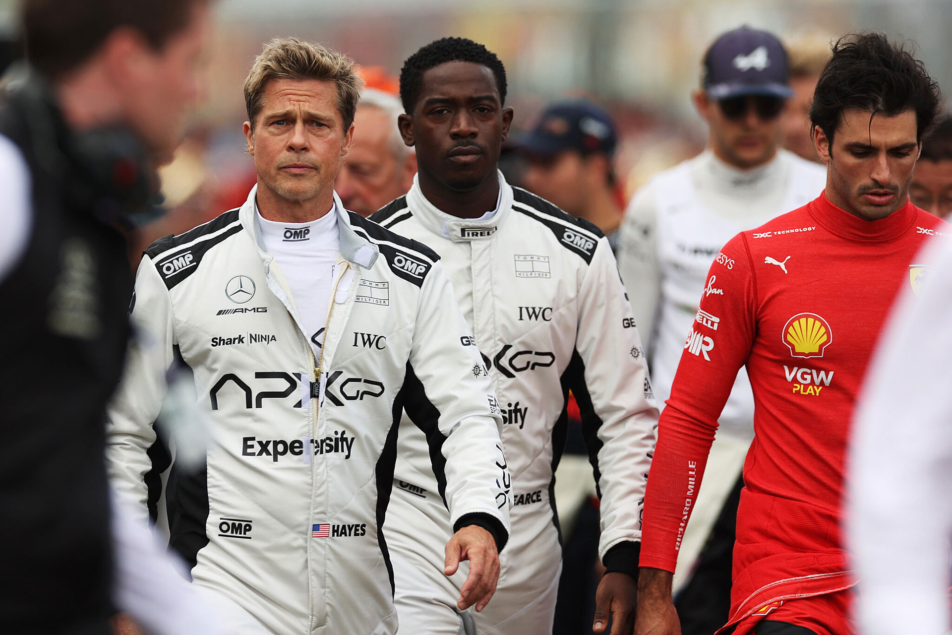 formula 1 drivers walking in group